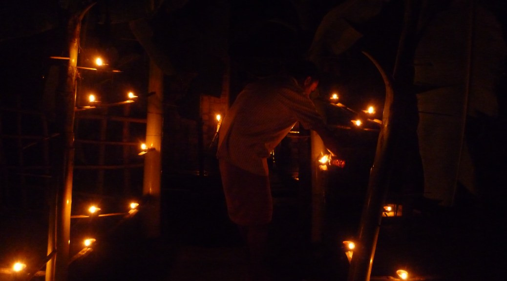Images from Majuli island of the locals lighting up oil lit lamps in banana stems