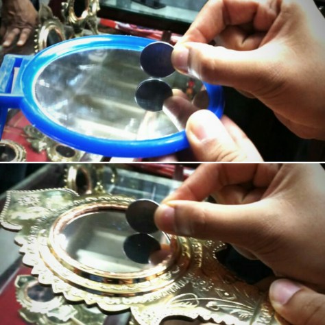 Two images that give the comparison of reflection in a glass and a metal mirror (Aranmula kannadi)